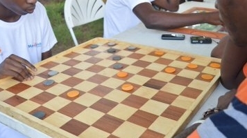Ghana: The board game Draughts is one of the popular pastimes for men - CGTN